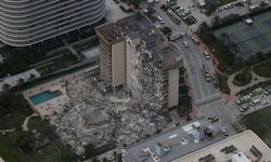 Al menos un muerto y 99 personas sin localizar tras derrumbe de apartamentos en Miami